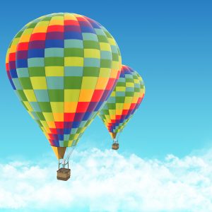 Two hot air balloons on blue sky